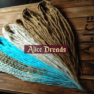 Dreadlock extensions synthetic dreads with Sahara blonde blue dreadlocks and wrapped hair accents