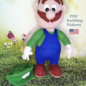 May include: Knitting pattern for a green and blue knitted doll with a brown moustache and a green hat. The pattern is a PDF download and includes instructions for making the doll. The pattern is available for purchase on Etsy.