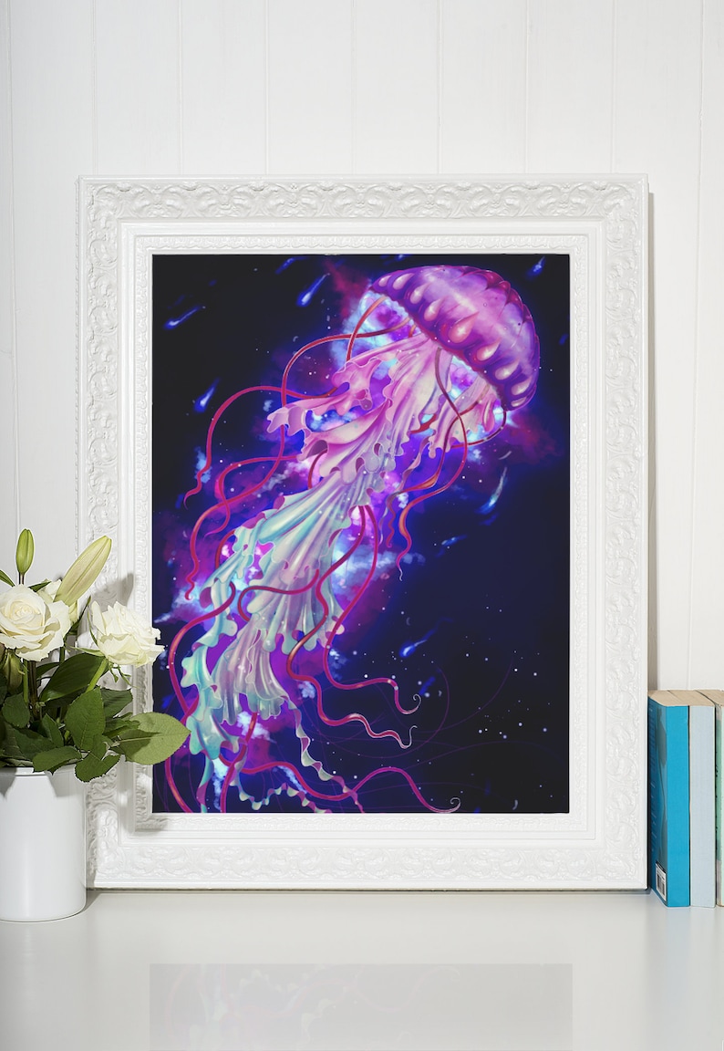 May include: A framed art print featuring a vibrant jellyfish illustration. The jellyfish is depicted in shades of purple, pink, and blue against a dark background. The artwork is framed in a white, ornate frame, adding a touch of elegance.