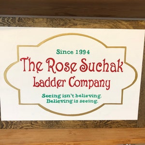 The Rose Suchak Ladder Co. Christmas Sign Framed in a Farmhouse Style