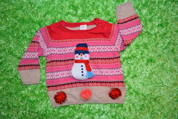 pink and green christmas sweater