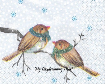 May include: Two brown birds with blue scarves perched on a branch against a light blue background with white snowflakes. The text "My Daydreaming Heart" is written below the birds.