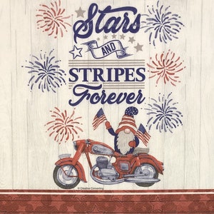 May include: A red, white, and blue gnome riding a red motorcycle with the words "Stars and Stripes Forever" above. The background is a white woodgrain pattern with red, white, and blue fireworks.
