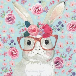 May include: A white bunny with pink and purple flowers in its hair and wearing brown glasses. The bunny is surrounded by a blue background with pink and purple flowers.