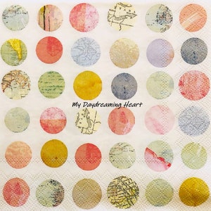 May include: A white napkin with a repeating pattern of colorful circles. Each circle features a vintage map design. The text "My Daydreaming Heart" is printed in the center of the napkin.