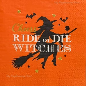 May include: Orange Halloween-themed napkin with a black witch silhouette riding a broom, holding a wine glass. The text reads "Cheers, Ride or Die Witches" in gold and white. Includes bat and star accents.