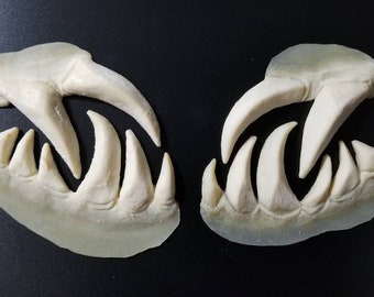 Pair of handmade, unpainted, unisex adult and children's latex dentures, specially made for skin.