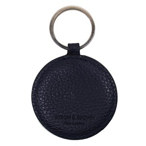 May include: A navy blue leather keychain with a round tag that says "Byron & Brown Fine Leather".