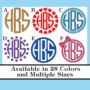 May include: Six different designs of monogrammed circles with the letters "HBS" in the center. The circles are in various colors, including gold, red, blue, purple, and pink. The designs include a heart border, a polka dot border, and a bow.