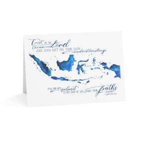 May include: A white greeting card with blue watercolor map of Indonesia and script text. The text reads "Trust in the Lord...and lean not on your own understanding...submit to Him and He will make your paths straight."