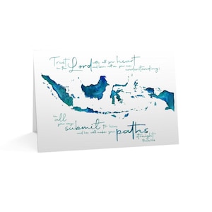 May include: A white greeting card featuring a watercolor map of Indonesia in shades of blue and teal. The card includes handwritten script with the words "Trust in the Lord" and "submit to him".