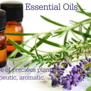 May include: Two amber glass bottles with black lids filled with essential oils. The bottles are surrounded by sprigs of rosemary, lavender, and mint.