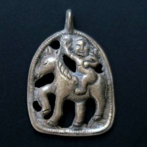 TIBETAN THOGCHAG PENDANT with Protectress Palden Lhamo on a Mule - Handcrafted Symbolic Bronze Tribal Jewelry from Nepal