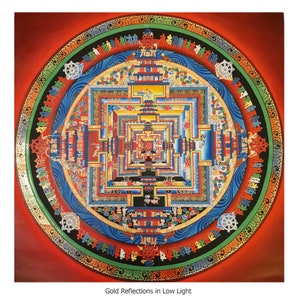 May include: A colorful mandala with intricate details and gold accents. The mandala is surrounded by a red background and the text "Gold Reflections in Low Light".