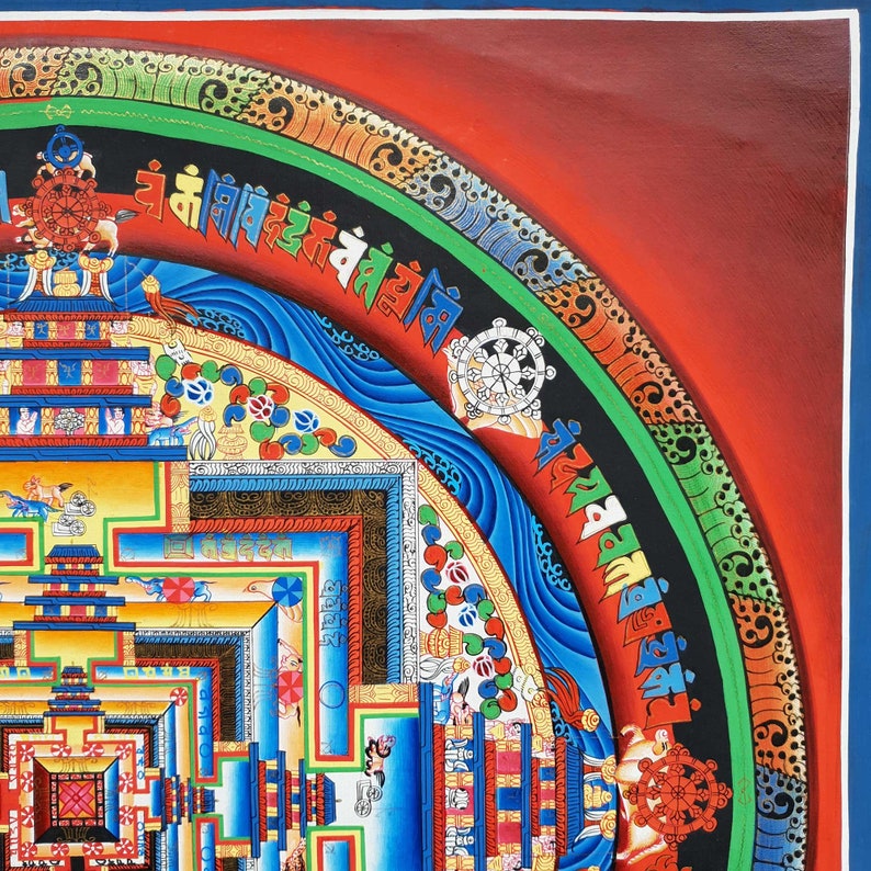 May include: A colorful mandala painting with intricate details and a red, green, and blue border. The mandala features a central square with a series of concentric circles and geometric patterns. The painting is framed in a dark wood frame.