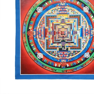 May include: A colorful mandala with intricate details and a central square surrounded by concentric circles. The mandala is painted in shades of red, blue, green, yellow, and gold.