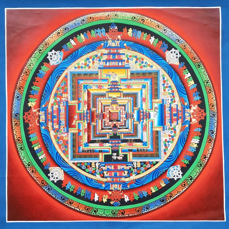 May include: A colorful mandala with a square design in the center. The mandala is surrounded by a circle of text and intricate patterns. The colors are red, blue, green, yellow, and gold.