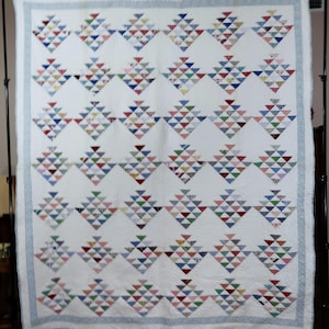Triangle Tiles Antique Quilt in a Wide Assortment of Feed Sack Prints with Blue Floral Print Border, Hand Quilted
