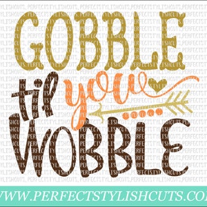 May include: Gobble til you wobble Thanksgiving themed graphic with an arrow and heart. The text is in brown and gold.
