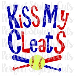 May include: Red and blue text that reads "Kiss My Cleats" with a yellow and black softball and two crossed baseball bats.