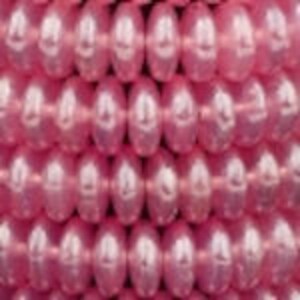 May include: A strand of pink pearl-like beads. The beads are oval shaped and have a smooth, glossy finish.
