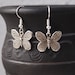 Robbin reviewed Little butterfly earrings Silver charms earrings Insect earrings Butterfly jewelry Little dangle earrings Gift for girl Spring jewelry