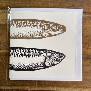 Imprimé sardines en linogravure noir et or | Carte-cadeau