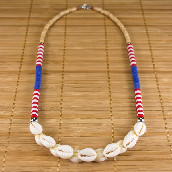 Half-long necklace blue, white, red in shells of Polynesia. Shell necklace. Colorful jewel with shells. Jewelry summer cowries