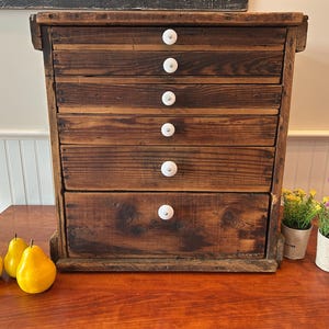Vintage Rustic Wooden Cabinet: Farmhouse Apothecary Chest with Porcelain Pulls