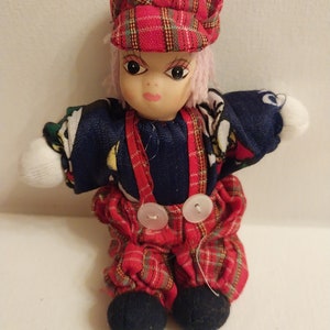Porcelain Doll With Sand Body In Red Plaid