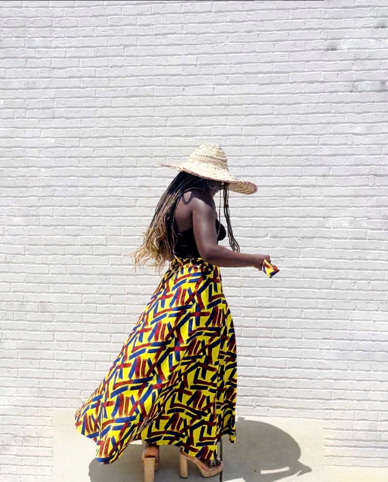 Black Woman Wearing Yellow African Print Wrap Skirt from Besida