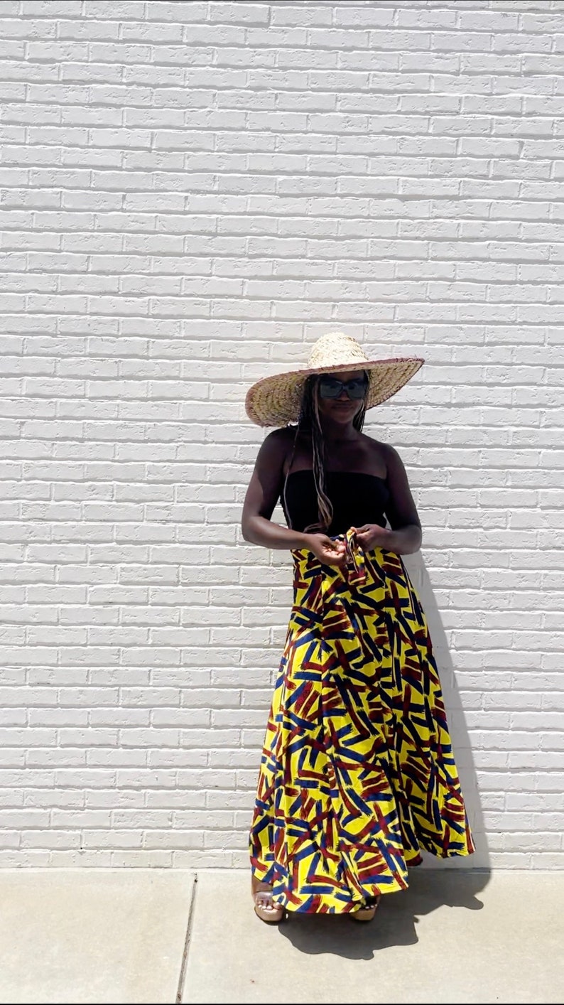 Black Woman Wearing Yellow African Print Wrap Skirt from Besida