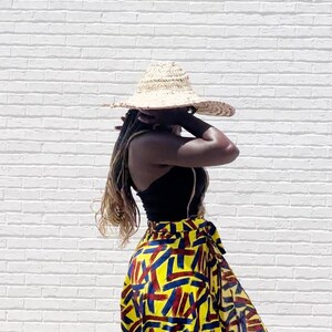 Black Woman Wearing Yellow African Print Wrap Skirt from Besida