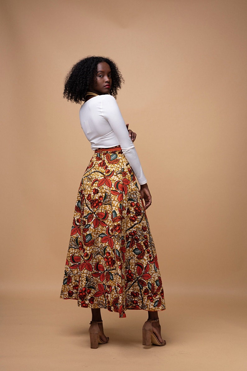 Black Woman Wearing Orange African Print Reversible Wrap Skirt from Besida