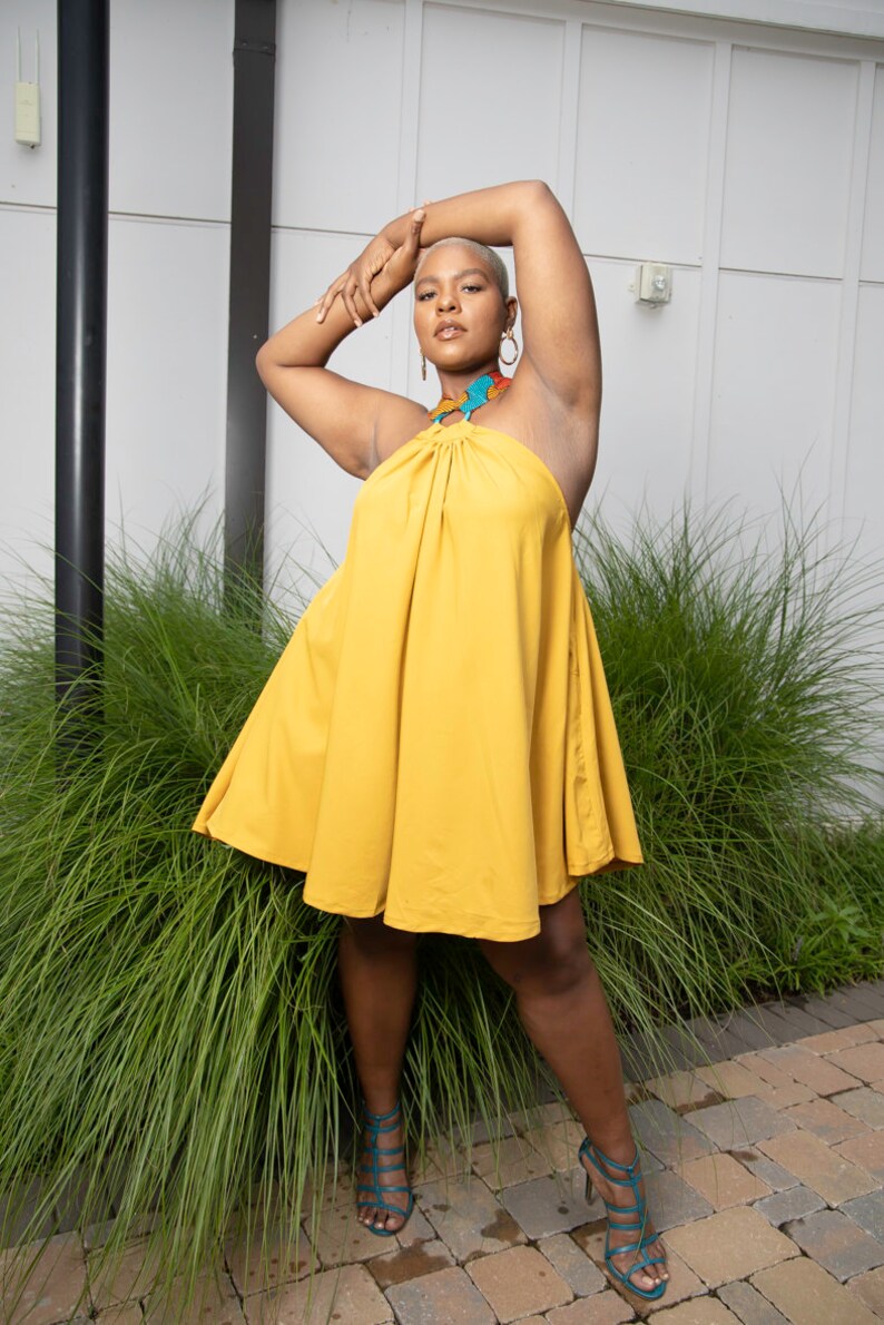 Black Women Wearing Yellow African Print Halter Neck Dress from Besida