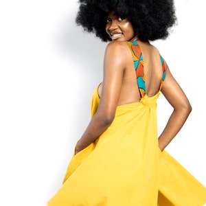 Black Woman Wearing Yellow African Print Halter Neck Dress from Besida