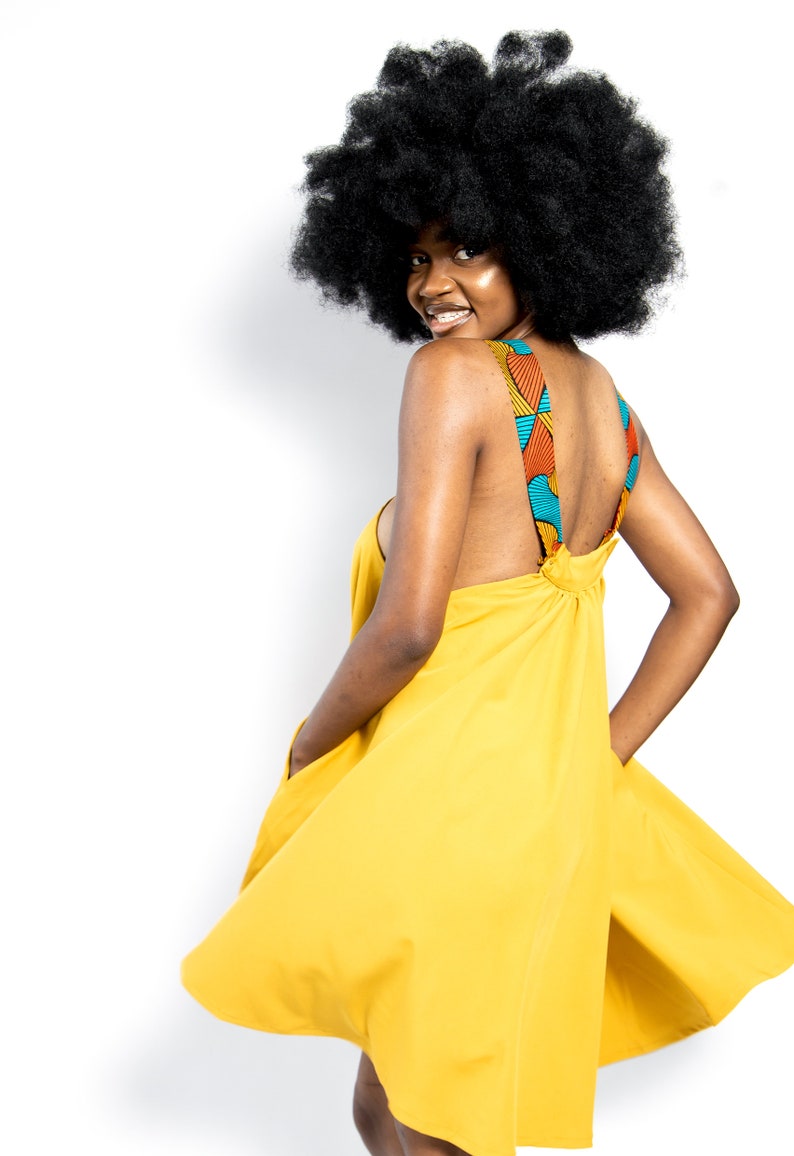 Black Woman Wearing Yellow African Print Halter Neck Dress from Besida