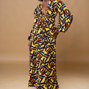 Black Woman Wearing Yellow African Print Wrap Skirt and Wrap Blouse from Besida