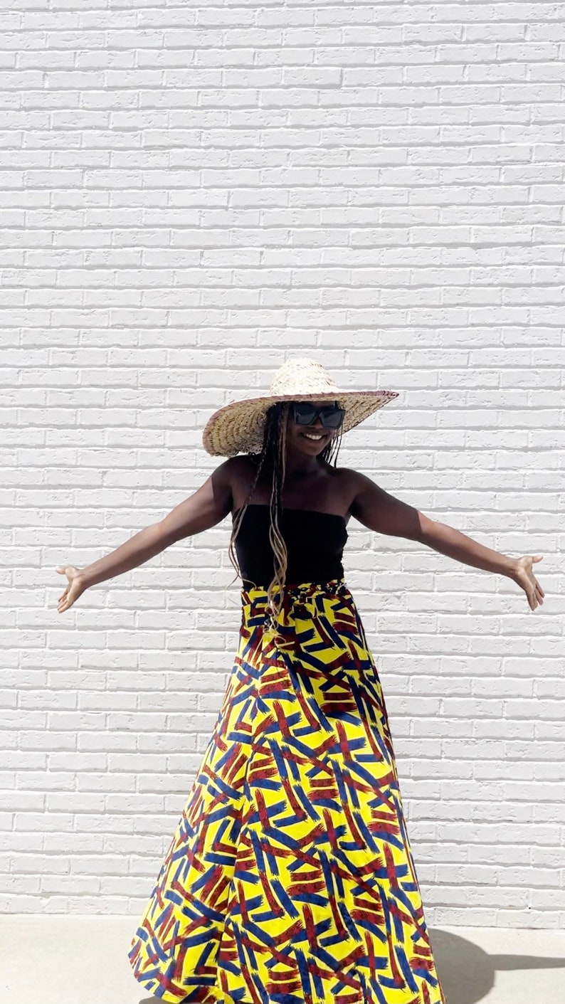 Black Woman Wearing Yellow African Print Wrap Skirt from Besida