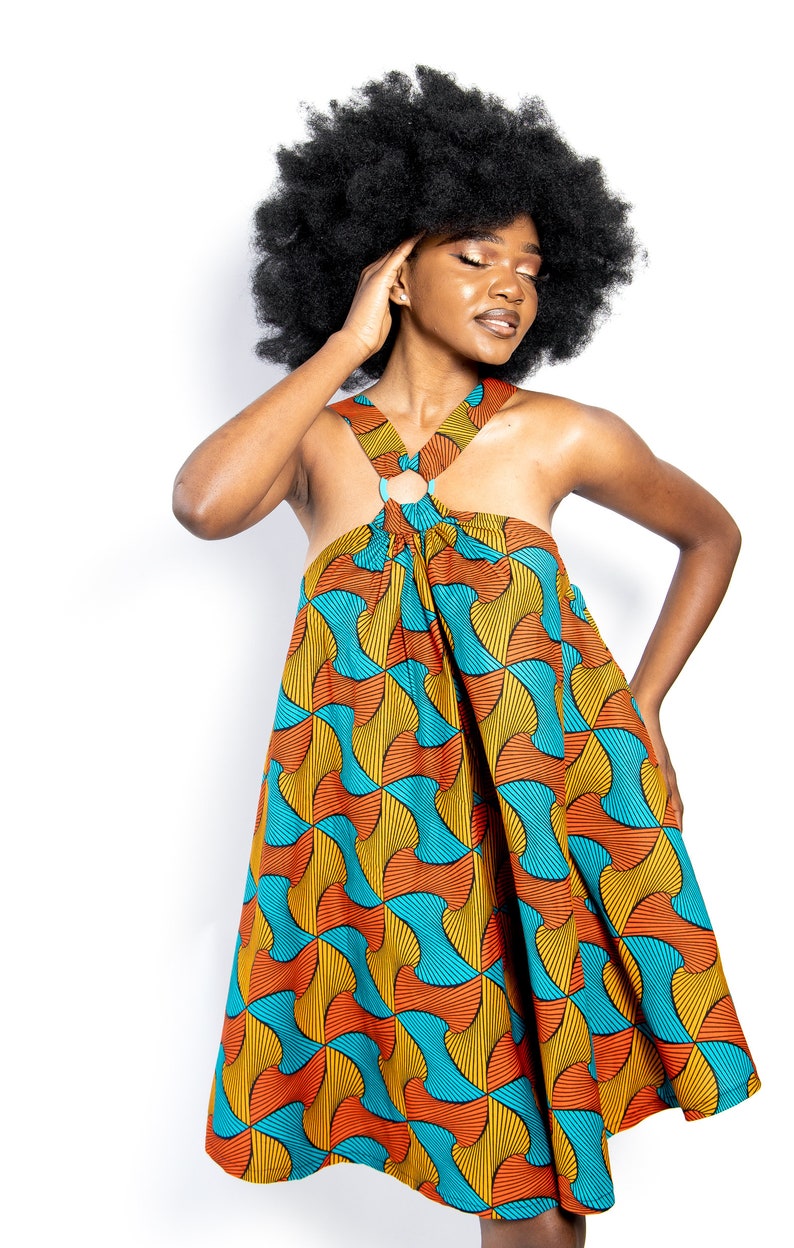 Black Woman Wearing Yellow and Blue African Print Halter Neck Dress from Besida