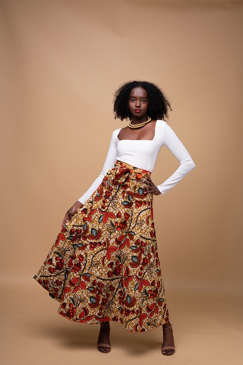 Black Woman Wearing Orange African Print Reversible Wrap Skirt from Besida