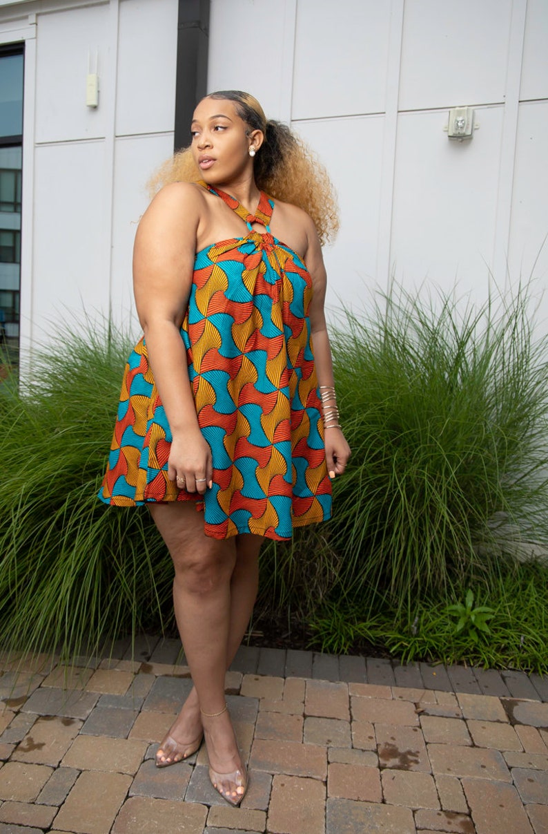 Black Woman Wearing Yellow and Blue African Print Halter Neck Dress from Besida