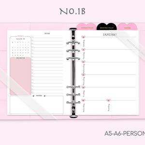 May include: A pink A5-A6 personal planner with a weekly and monthly layout. The planner features a pink and black heart design and includes a calendar, to-do list, and notes section.