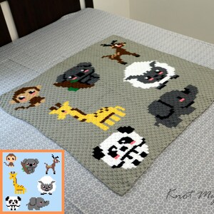 May include: A gray crocheted baby blanket featuring various animal designs, including a giraffe, panda, elephant, and sheep. The blanket is square-shaped and has a textured appearance, with the animals in a pixelated style.