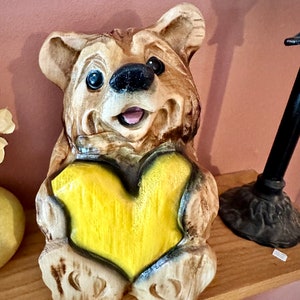 Chainsaw carved Bear with yellow heart woodcarving decor log home rustic wood art handcrafted unique woodcarved fun gift for bear-lover