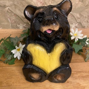 Chainsaw-carved black bear with yellow heart wood carving decor for log home rustic lodge unique wooden bear chainsaw carving gift for mom