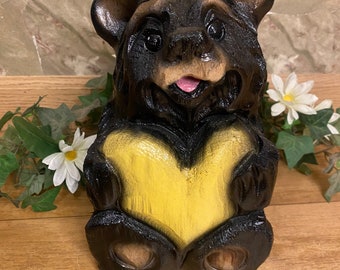 Chainsaw-carved black bear with yellow heart wood carving decor for log home rustic lodge unique wooden bear chainsaw carving gift for mom