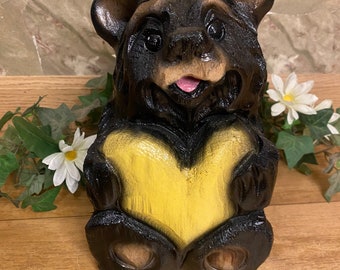 Chainsaw-carved black bear with yellow heart wood carving decor for log home rustic lodge unique wooden personalizable bear gift for mom