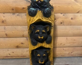 Three bears in a stump