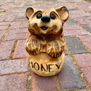 Cute chainsaw carved handcrafted bear in honeypot wood carving adorable wooden figurine unique rustic handmade log home cabin porch wood art